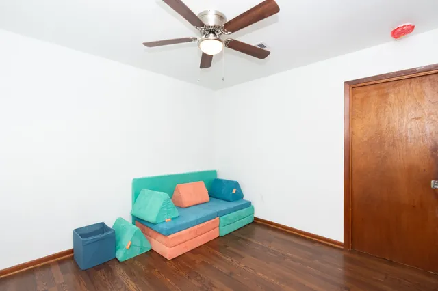 a room with painting and a wooden floor