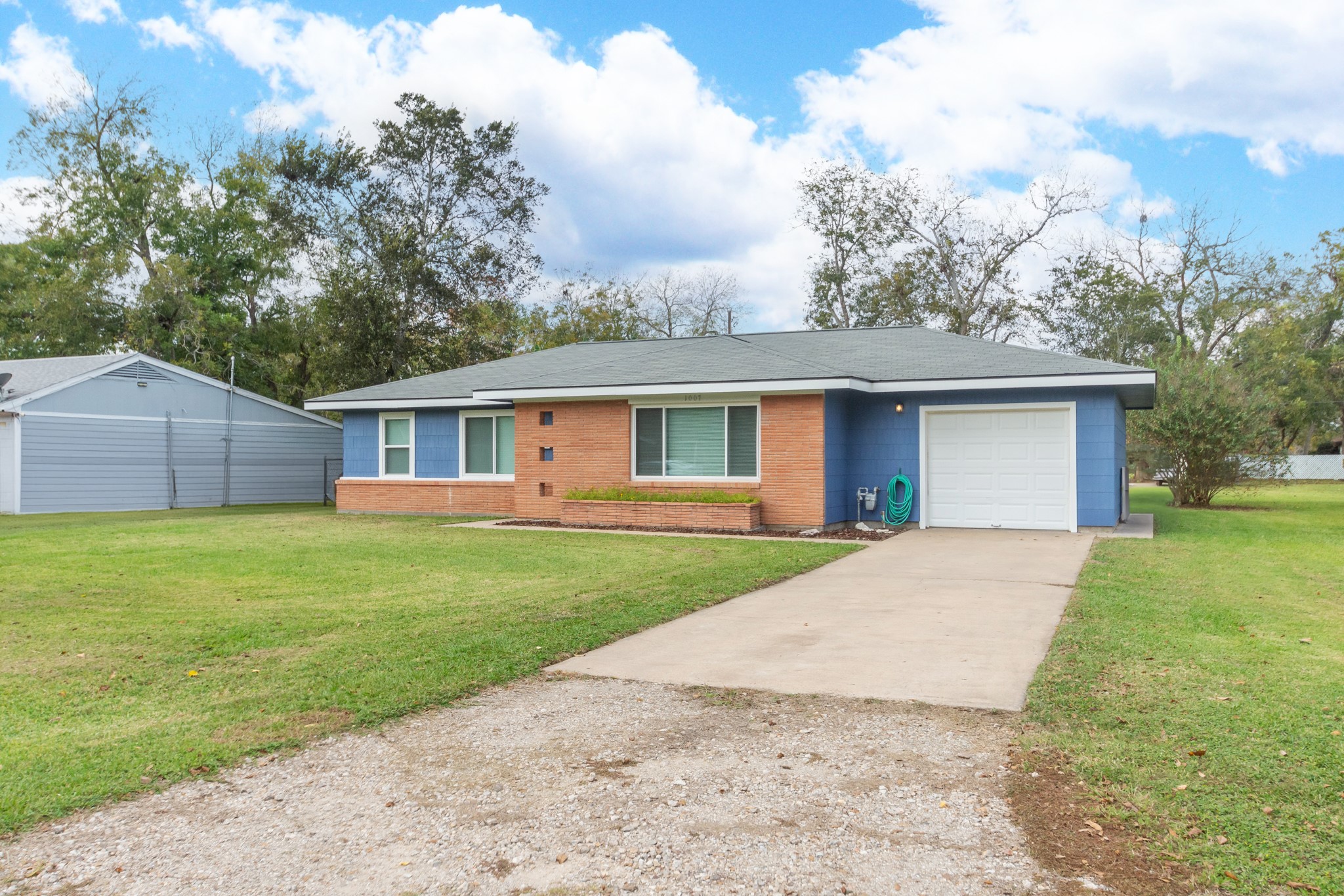 1007 Earley Street Sweeny, TX 77480 - Photo 3 of 33 a front view of house with yard and green space