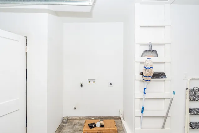 a room with a table and a lamp