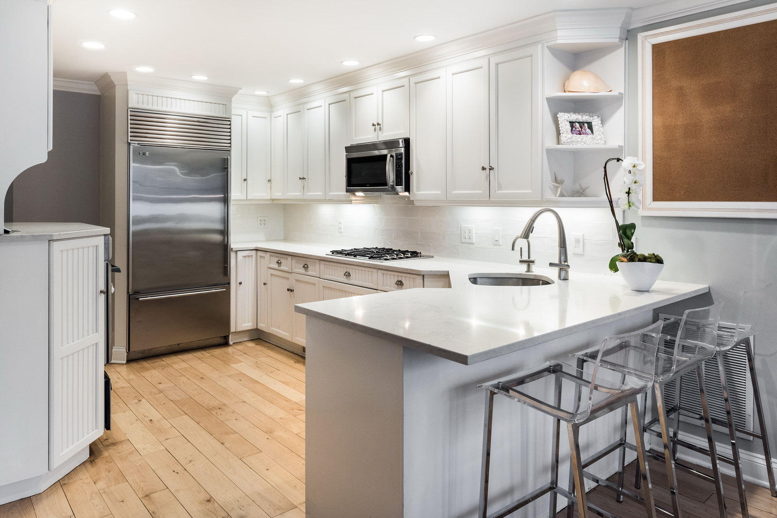 23 Waverly Road Darien, CT 06820 - Photo 11 of 28 a kitchen with kitchen island a sink appliances and cabinets