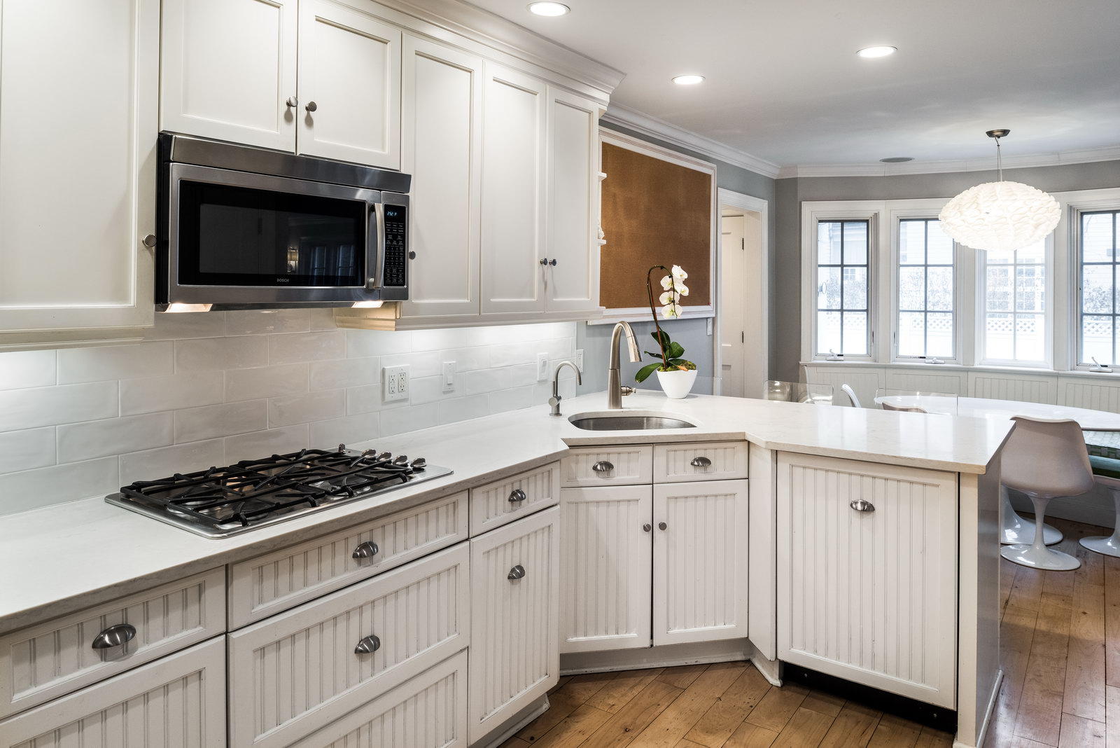23 Waverly Road Darien, CT 06820 - Photo 12 of 28 a kitchen with white cabinets and sink