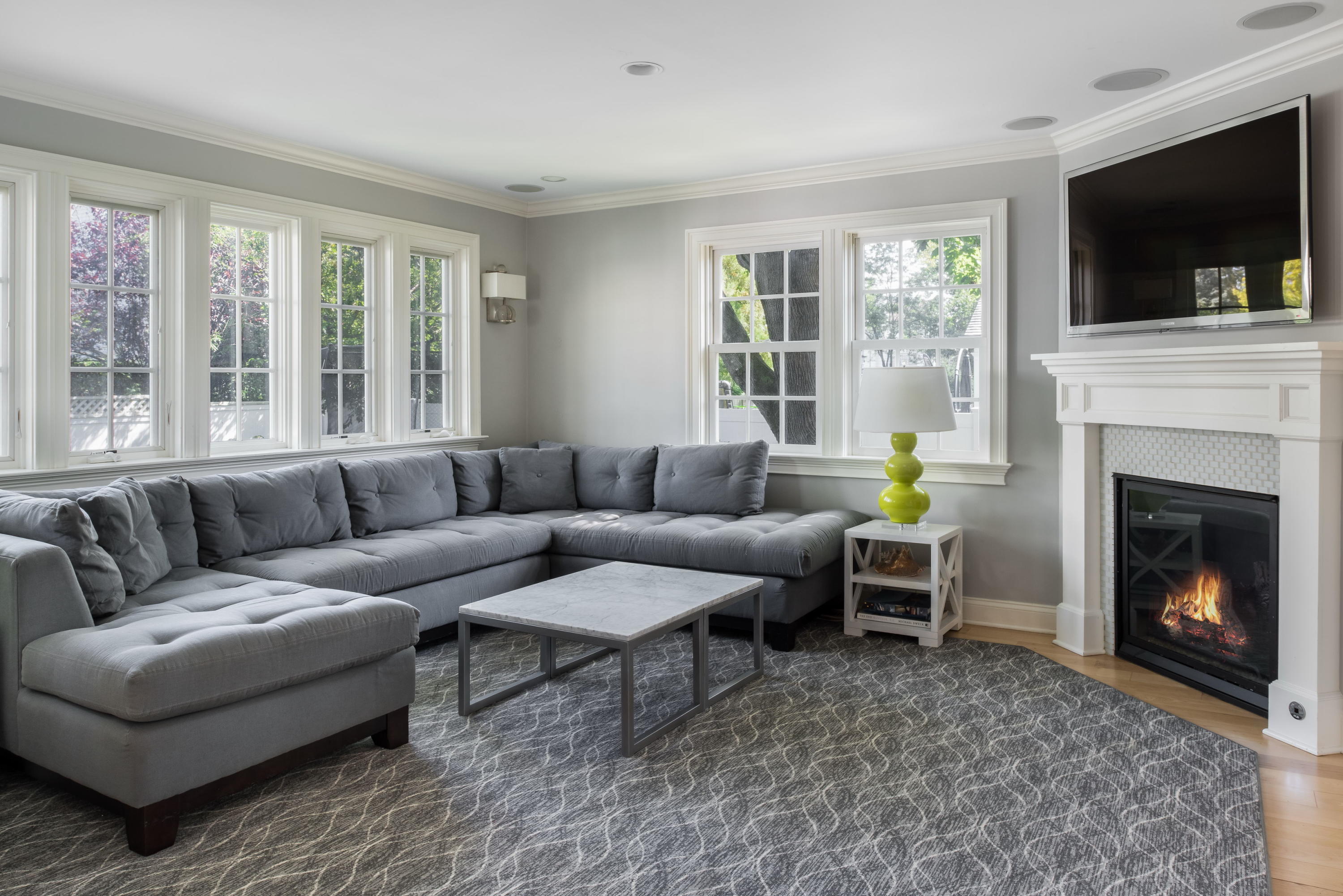 23 Waverly Road Darien, CT 06820 - Photo 14 of 28 a living room with furniture a flat screen tv and a fireplace