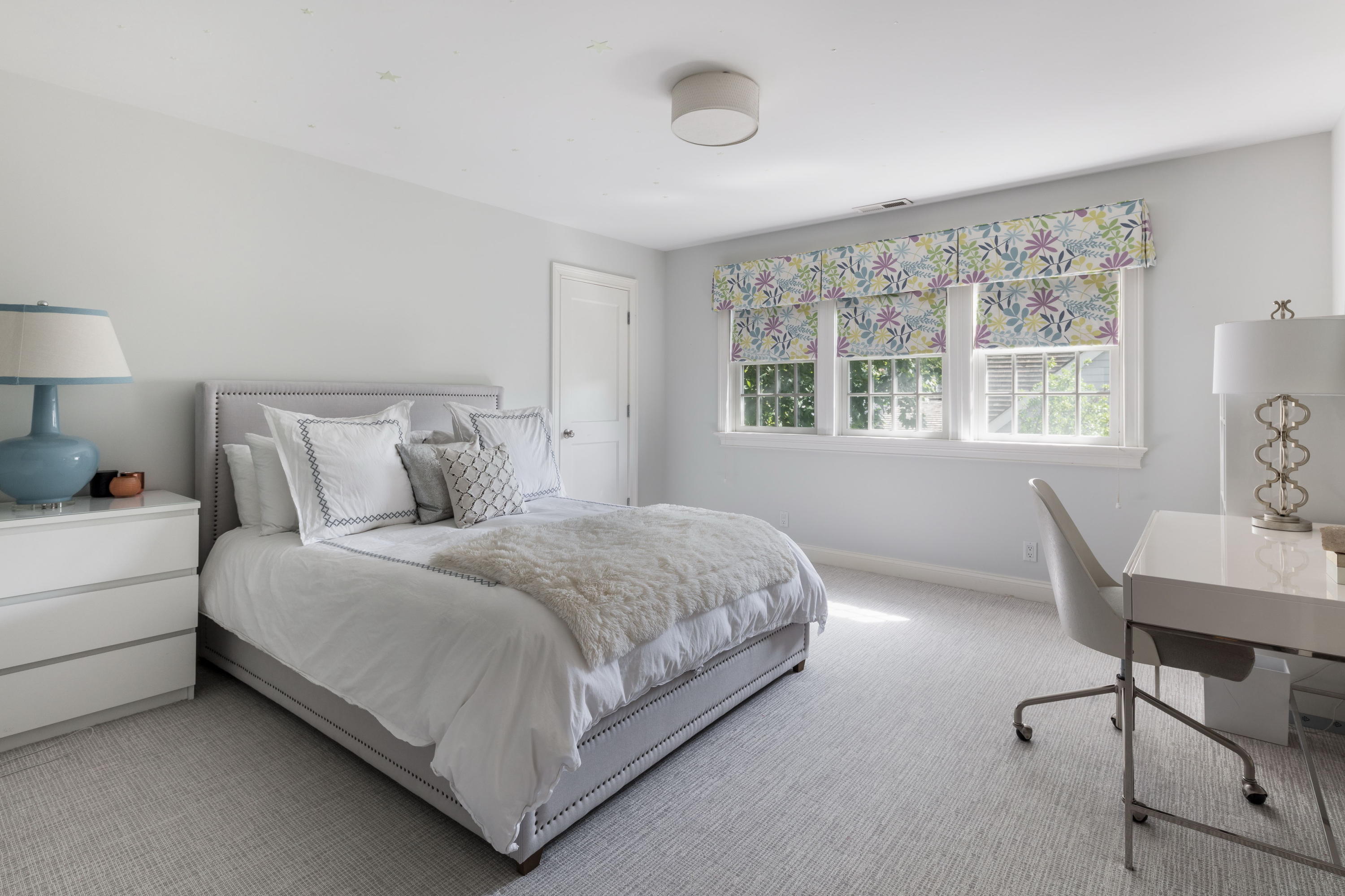 23 Waverly Road Darien, CT 06820 - Photo 18 of 28 a bedroom with a bed a table and windows