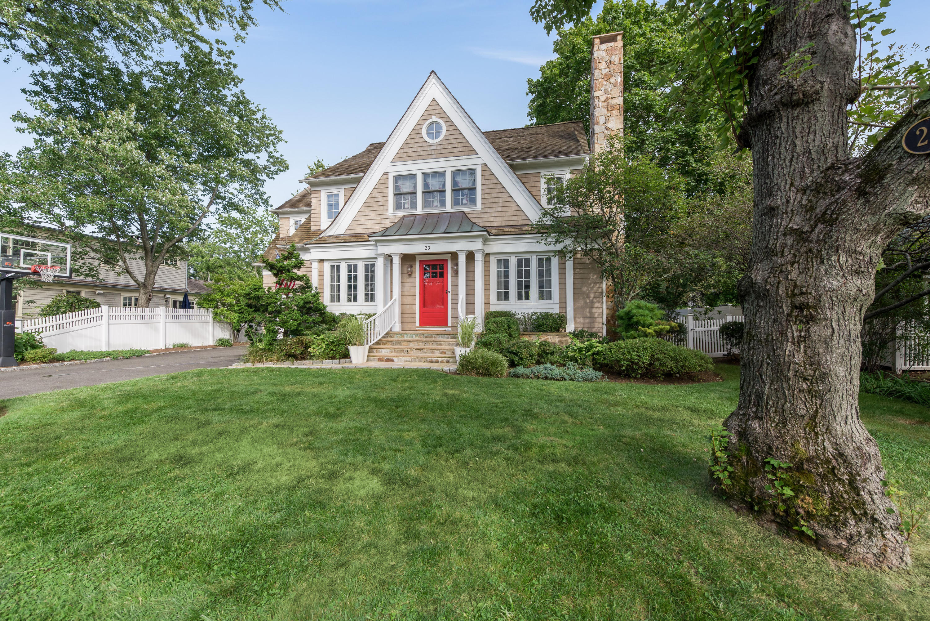 23 Waverly Road Darien, CT 06820 - Photo 2 of 28 a front view of a house with a yard