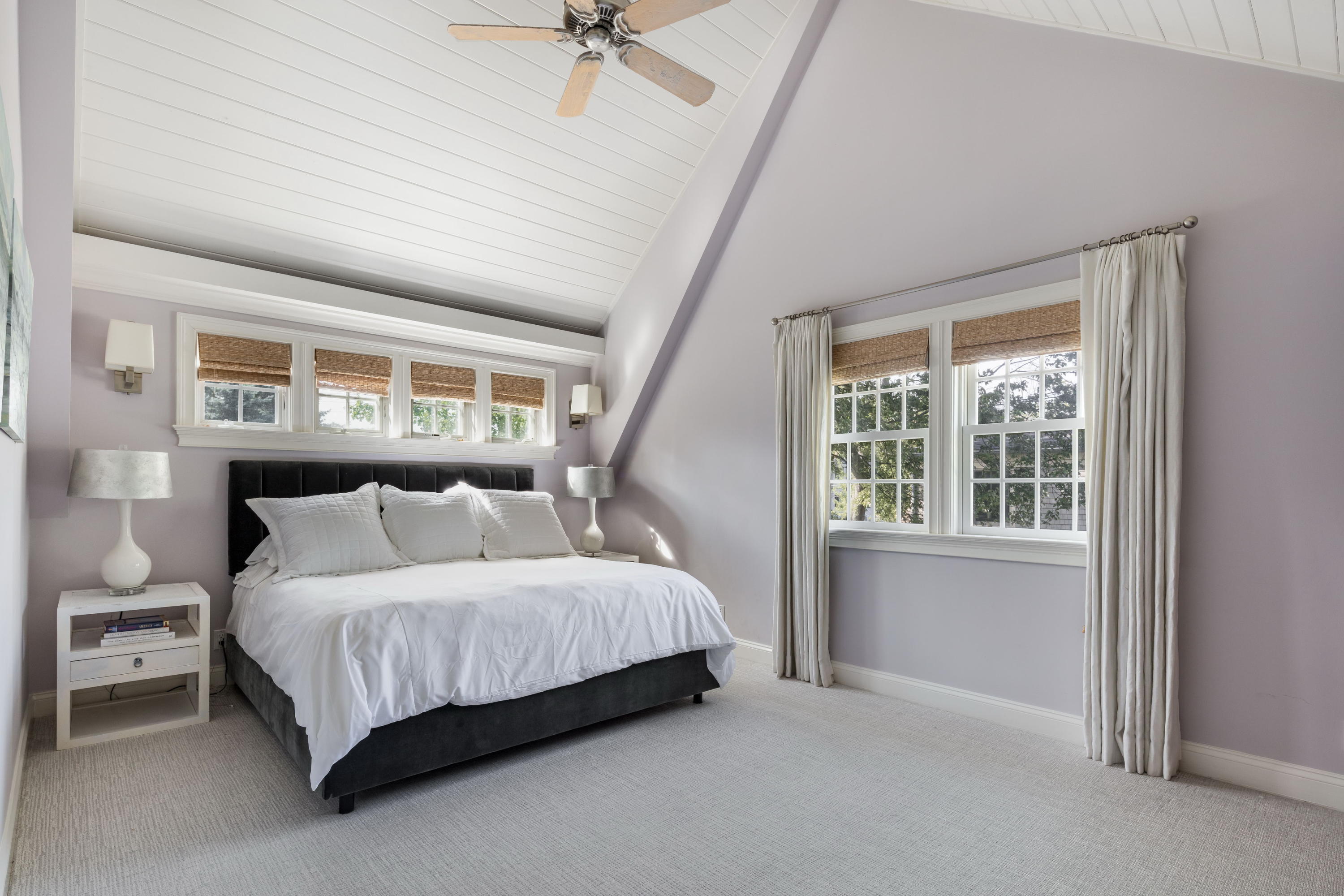 23 Waverly Road Darien, CT 06820 - Photo 21 of 28 a bedroom with a bed lamp and a large window