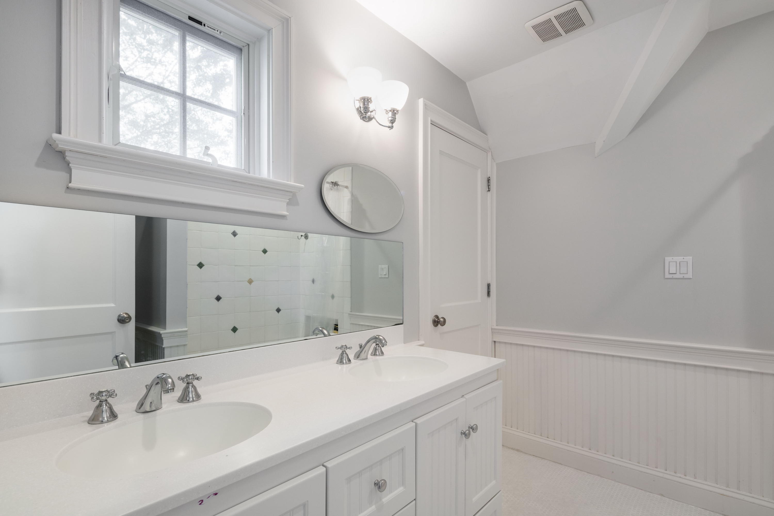 23 Waverly Road Darien, CT 06820 - Photo 23 of 28 a bathroom with a sink and a mirror