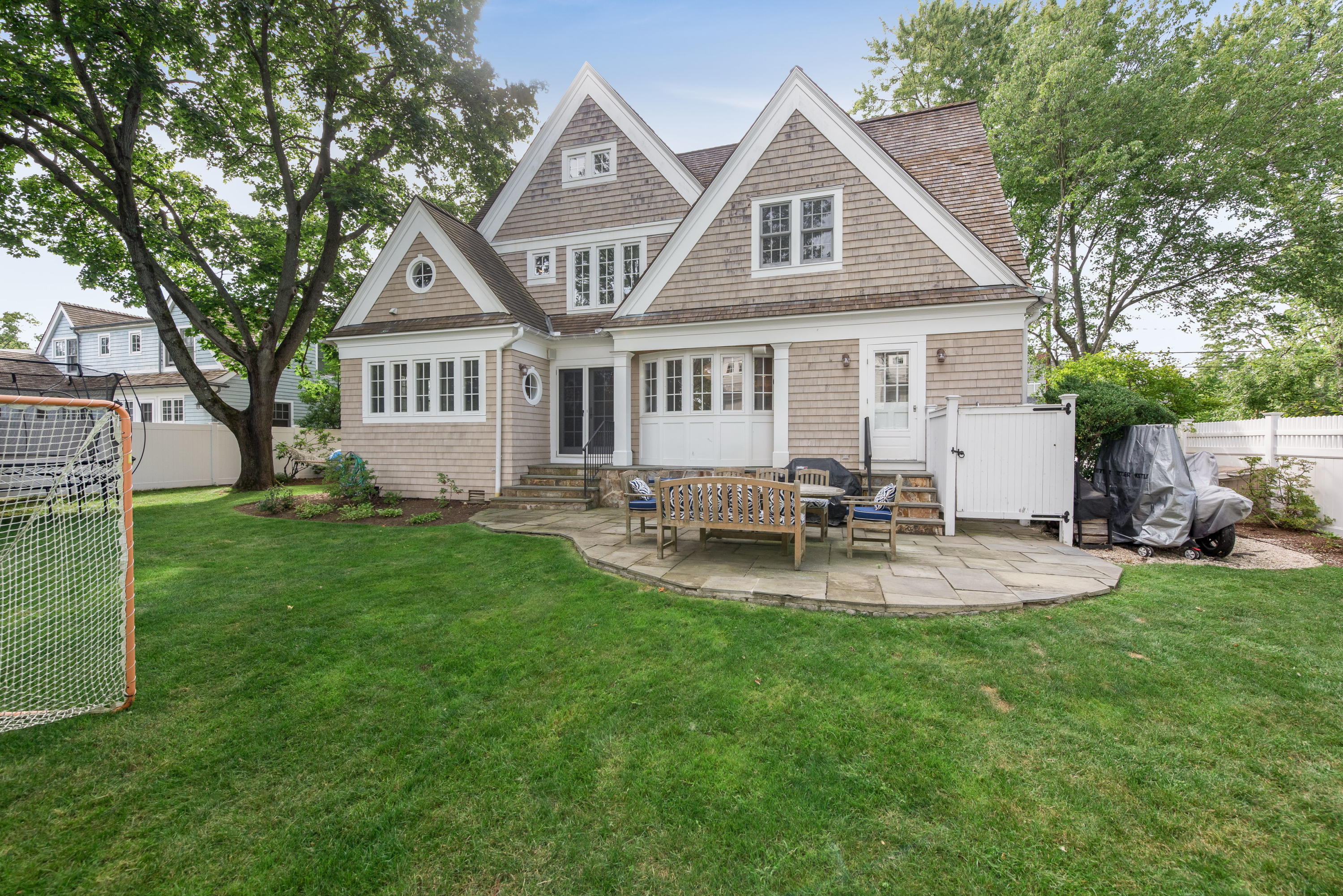 23 Waverly Road Darien, CT 06820 - Photo 26 of 28 a front view of a house with patio and garden