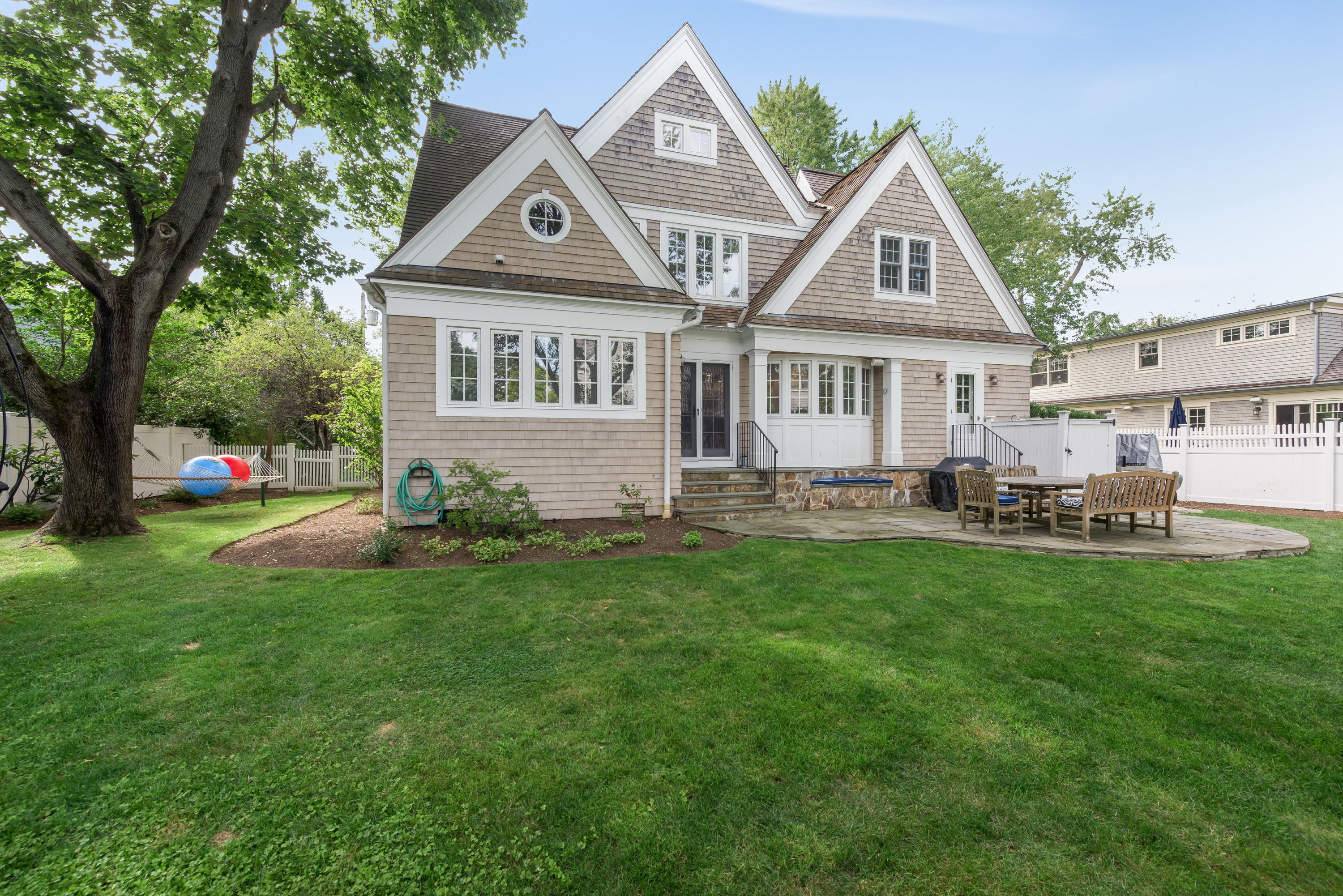 23 Waverly Road Darien, CT 06820 - Photo 3 of 28 a front view of a house with a garden and trees
