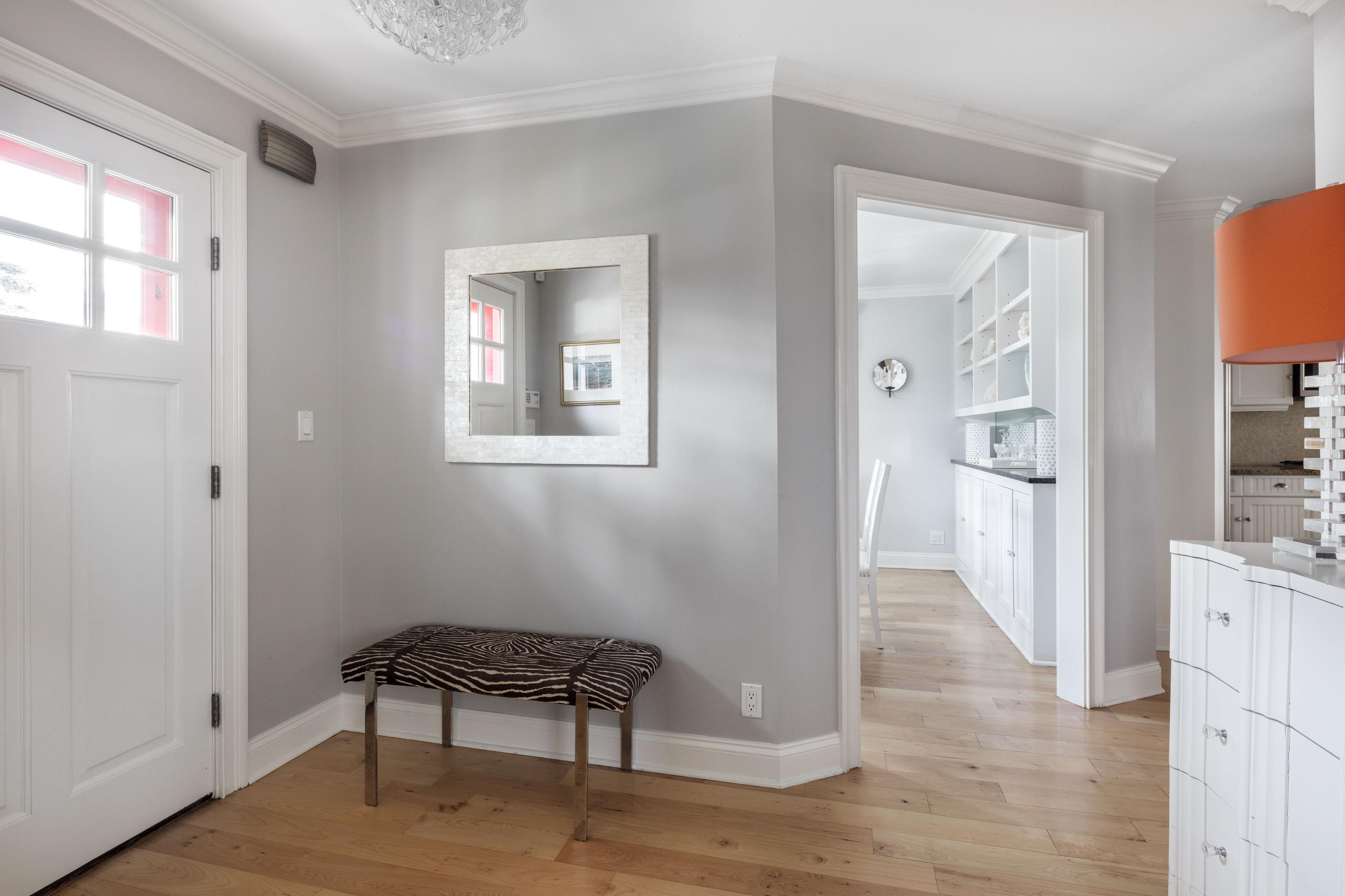 23 Waverly Road Darien, CT 06820 - Photo 6 of 28 a hallway with a wooden floor and a bathroom