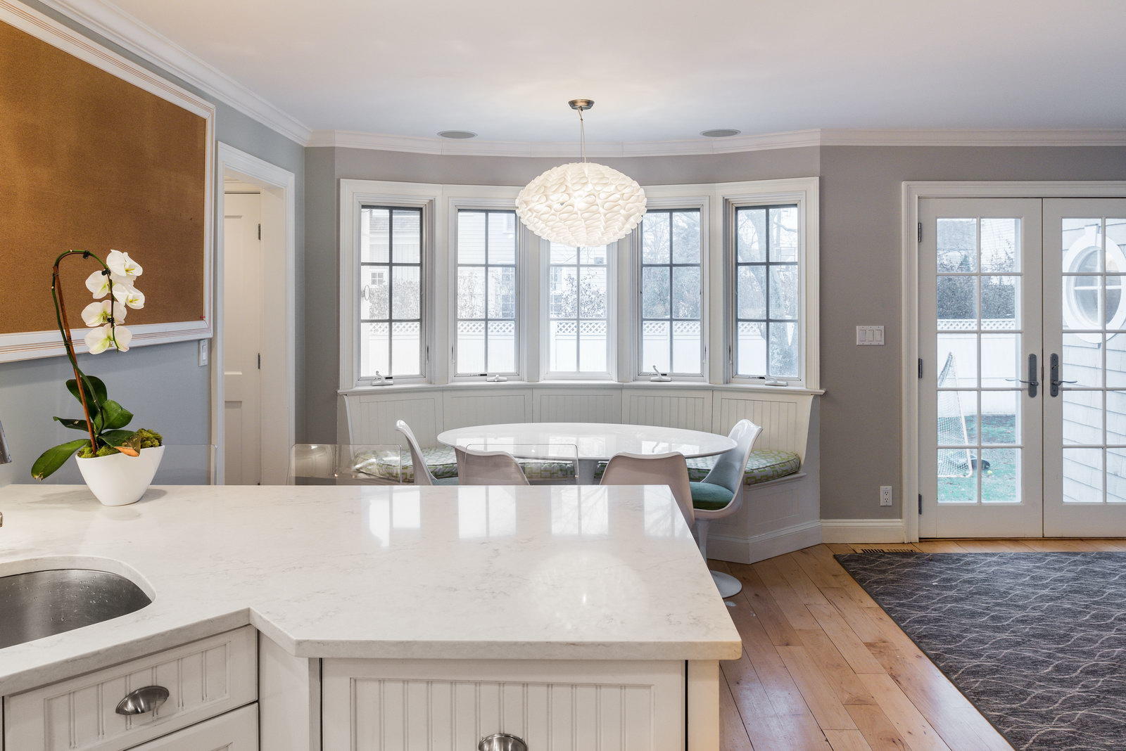 23 Waverly Road Darien, CT 06820 - Photo 10 of 28 a view of a kitchen with granite countertop a sink dishwasher with a dining table and chair with wooden floor