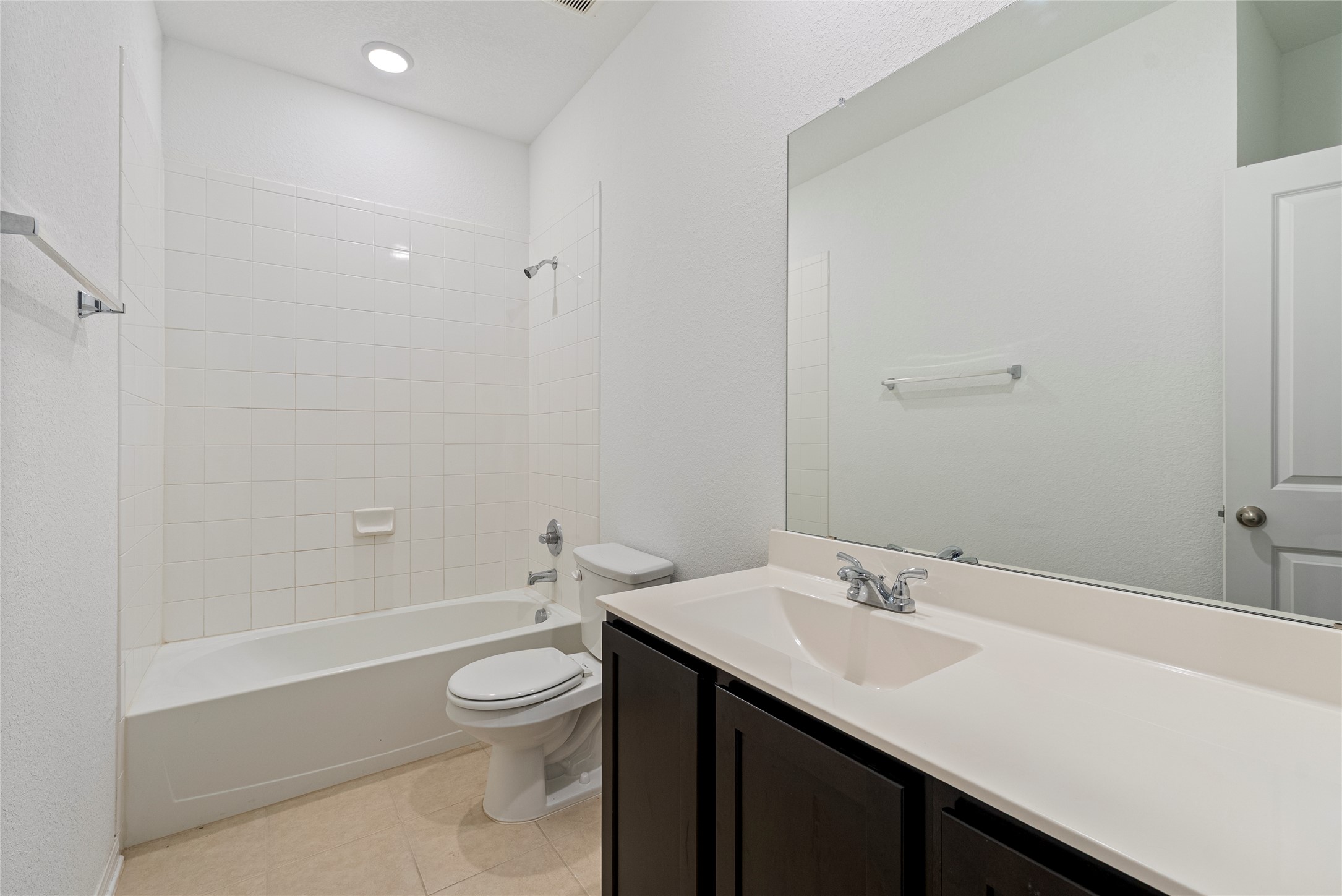 149 Biscayne Drive Kyle, TX 78640 - Photo 16 of 20 a bathroom with a sink a toilet and shower
