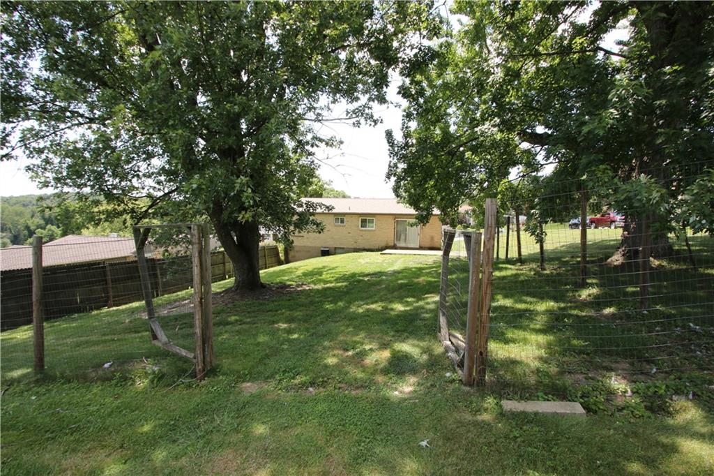 66 Blair Road Eighty Four, PA 15330 - Photo 5 of 26 Partially Fenced Backyard just outside of Sliding Glass Door from Kitchen