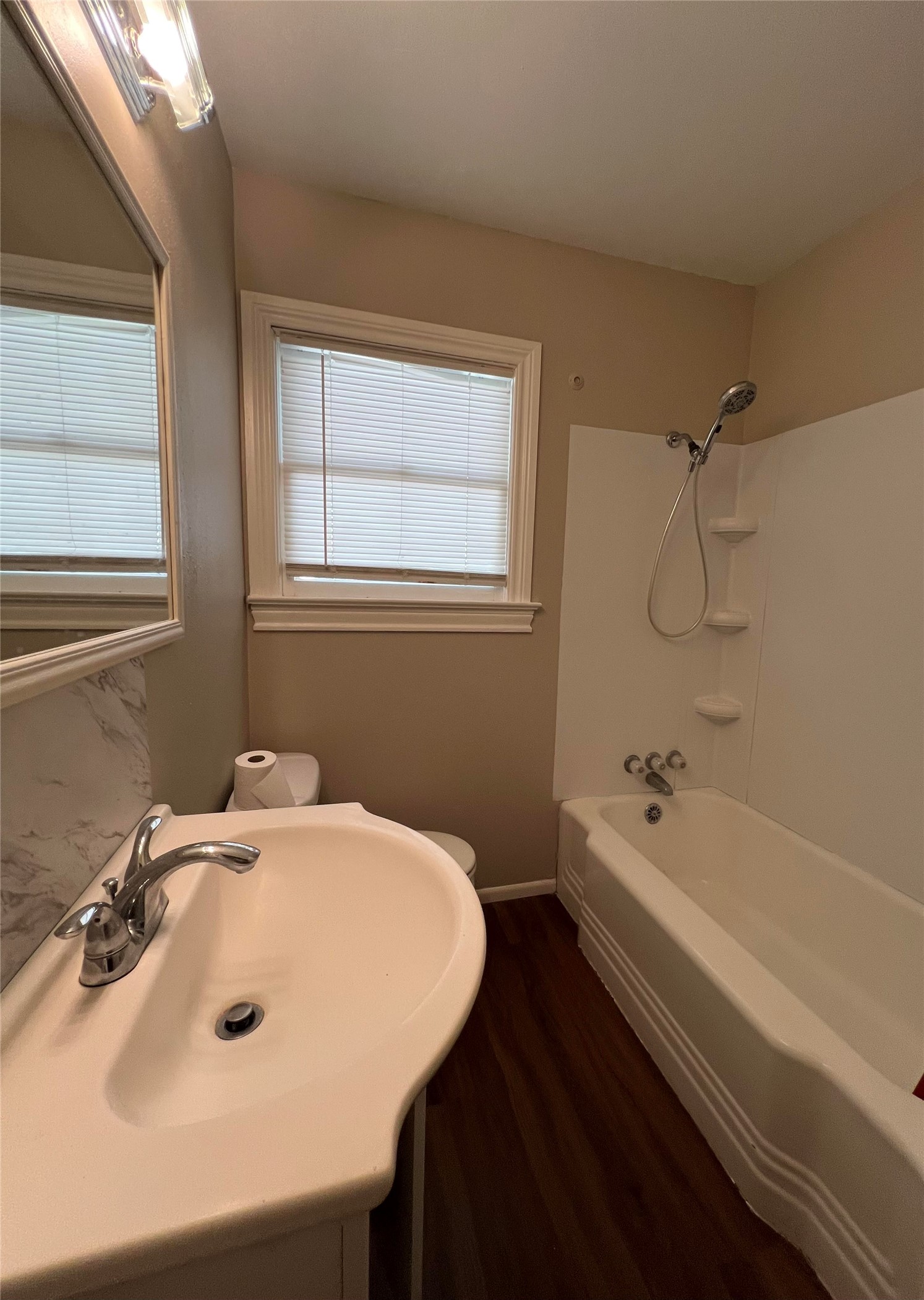 613 Koehl Street Wharton, TX 77488 - Photo 6 of 10 a bathroom with a bathtub and a sink