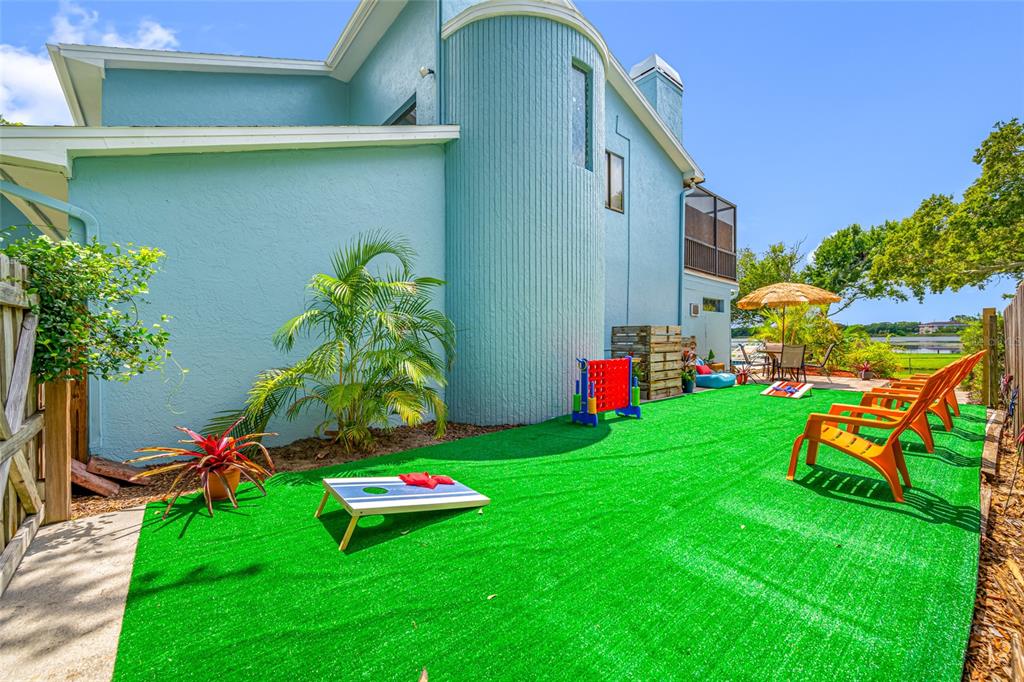 2153 Karan Way Clearwater, FL 33763 - Photo 64 of 65 a view of a chair and table in backyard