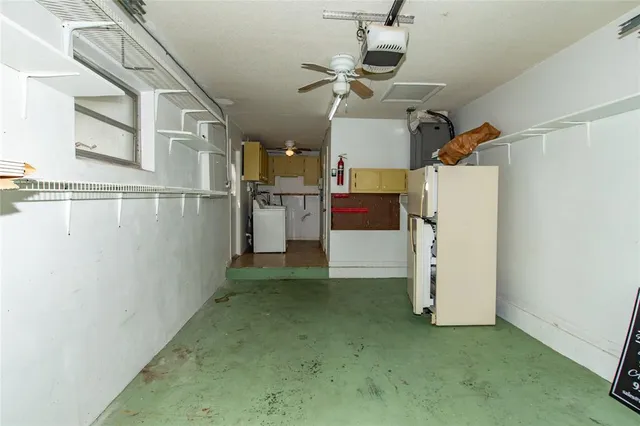a view of a storage & utility room with a kitchen