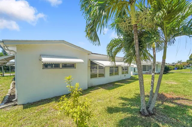 a view of a house with swimming pool