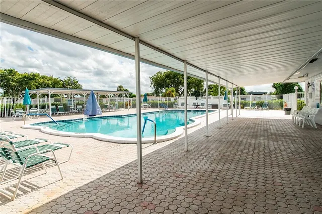 a view of a swimming pool with a patio