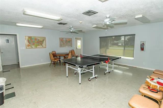 a work room with furniture and a chandelier
