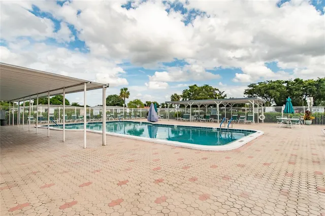a view of a swimming pool and a yard