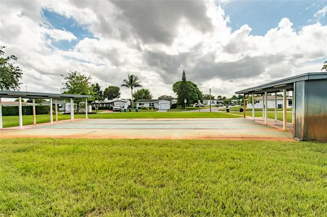 a view of a swimming pool with an outdoor space and seating