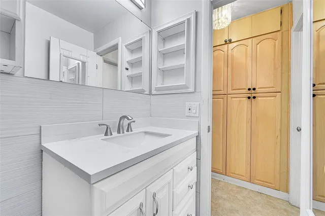a bathroom with a sink and a mirror