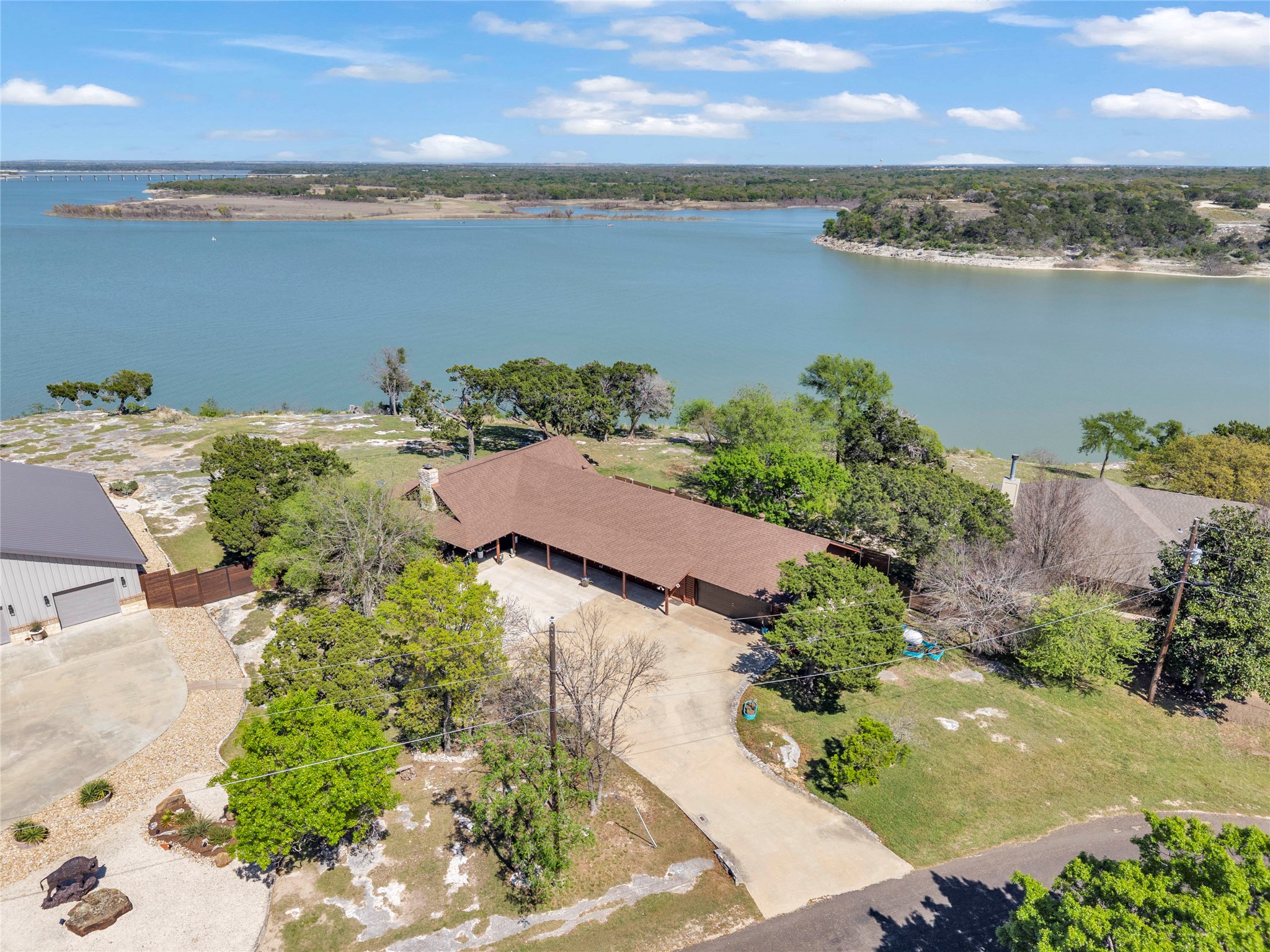 an aerial view of ocean with residential house with outdoor space