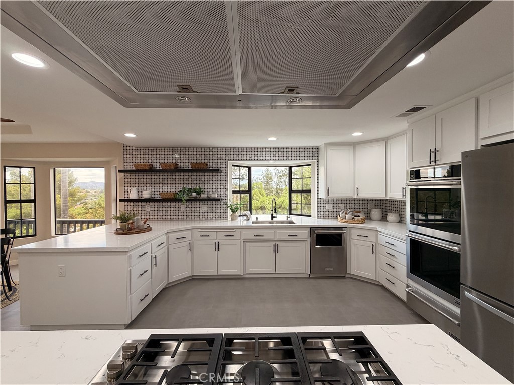 1677 South Hill Avenue Fallbrook, CA 92028 - Photo 17 of 74 Dream kitchen! Lots of storage, double ovens, six burner cooktop. Breakfast nook to the left. Views over the valley!