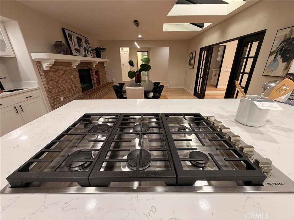 1677 South Hill Avenue Fallbrook, CA 92028 - Photo 23 of 74 a large mirror sitting on a floor in front of a fireplace