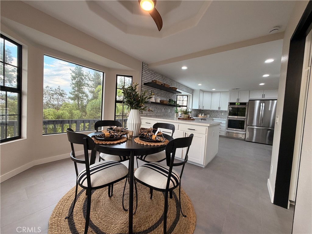 1677 South Hill Avenue Fallbrook, CA 92028 - Photo 25 of 74 a view of a dining room with furniture window and outside view