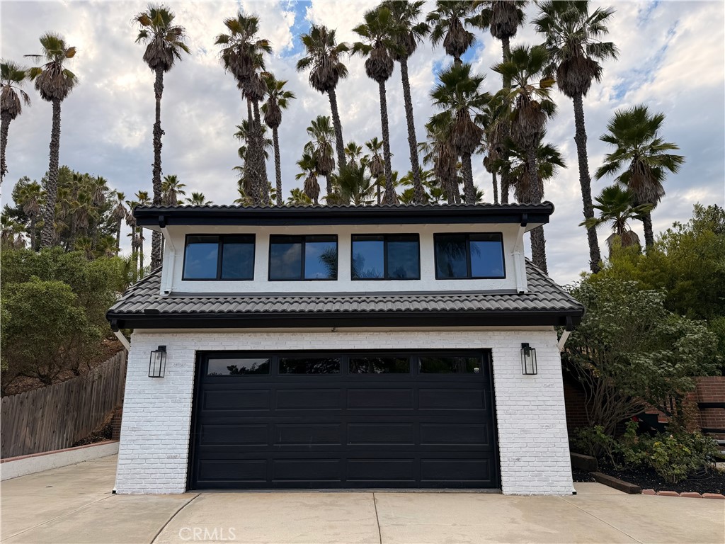 1677 South Hill Avenue Fallbrook, CA 92028 - Photo 4 of 74 a front view of a house with a garden