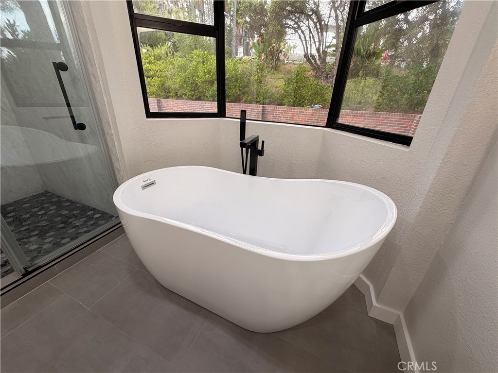 1677 South Hill Avenue Fallbrook, CA 92028 - Photo 51 of 74 a white bath tub sitting in a bathroom next to a window
