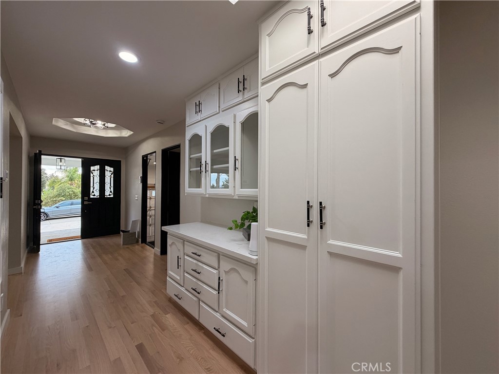 1677 South Hill Avenue Fallbrook, CA 92028 - Photo 54 of 74 a view of a hallway with wooden floor and cabinet
