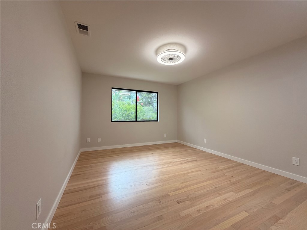 1677 South Hill Avenue Fallbrook, CA 92028 - Photo 57 of 74 an empty room with wooden floor and windows