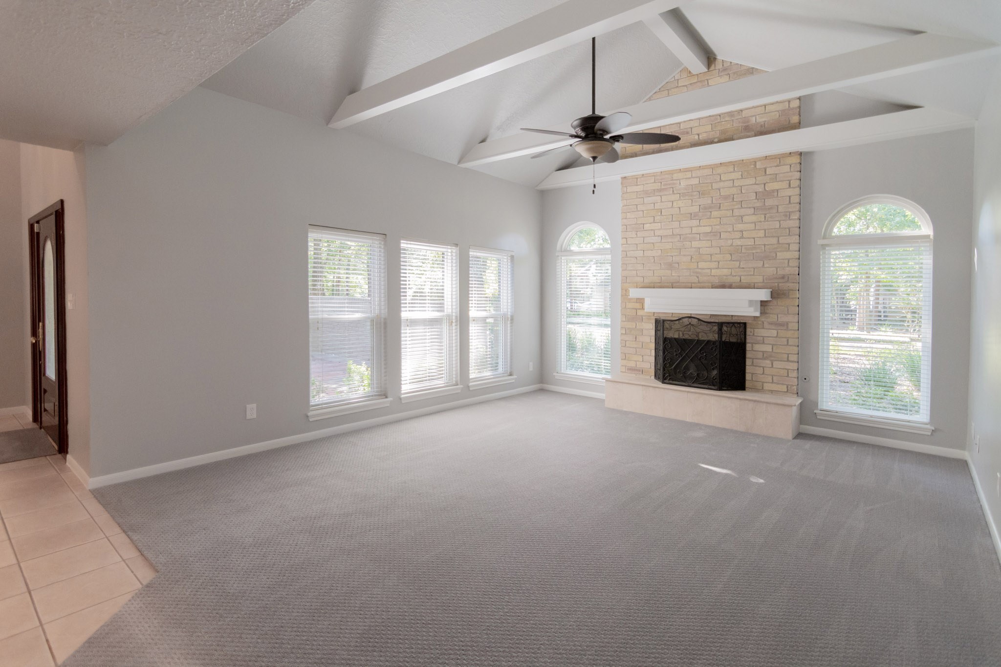 10 Coralvine Court Spring, TX 77380 - Photo 10 of 34 Spacious family room has ample space for comfortable furnishings and allows enough room to float the furniture.