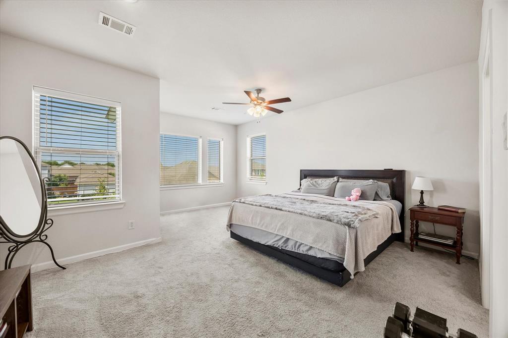 9224 Lamar Street Rowlett, TX 75089 - Photo 12 of 27 Spacious room featuring light-colored carpeting and multiple windows with horizontal blinds
