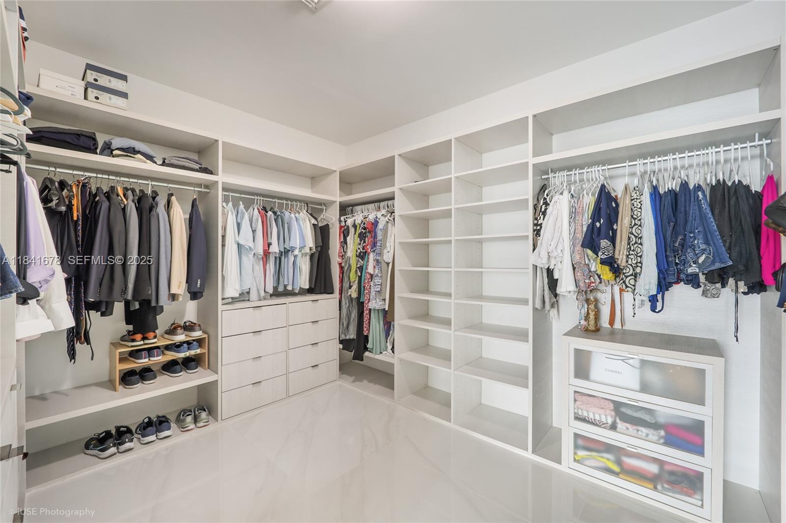 88 Southwest 7th Street, Unit 4101 Miami, FL 33130 - Photo 24 of 35 a view of walk in closet with clothes and shoes