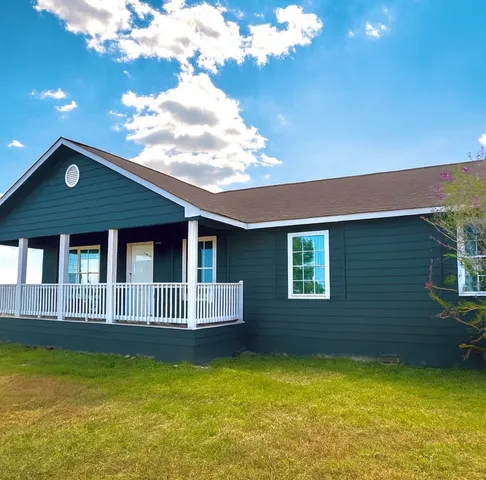 a view of a house with a swimming pool