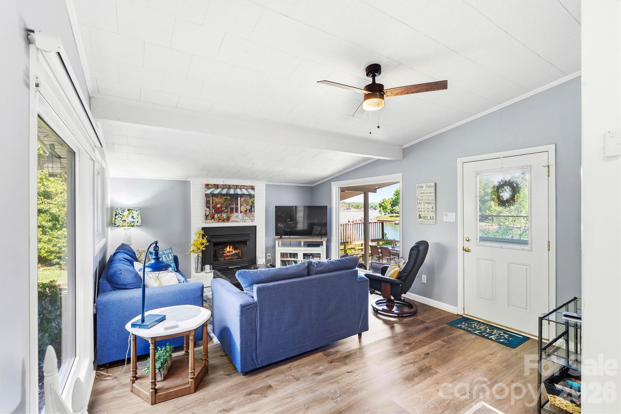 6566 Harbor Lane Conover, NC 28613 - Photo 13 of 43 a living room with furniture flat screen tv and a large window