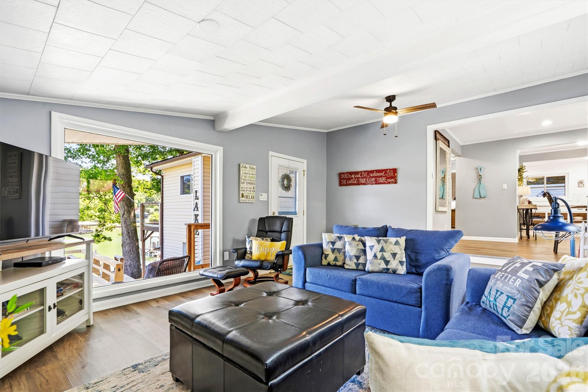6566 Harbor Lane Conover, NC 28613 - Photo 15 of 43 a living room with furniture and a flat screen tv