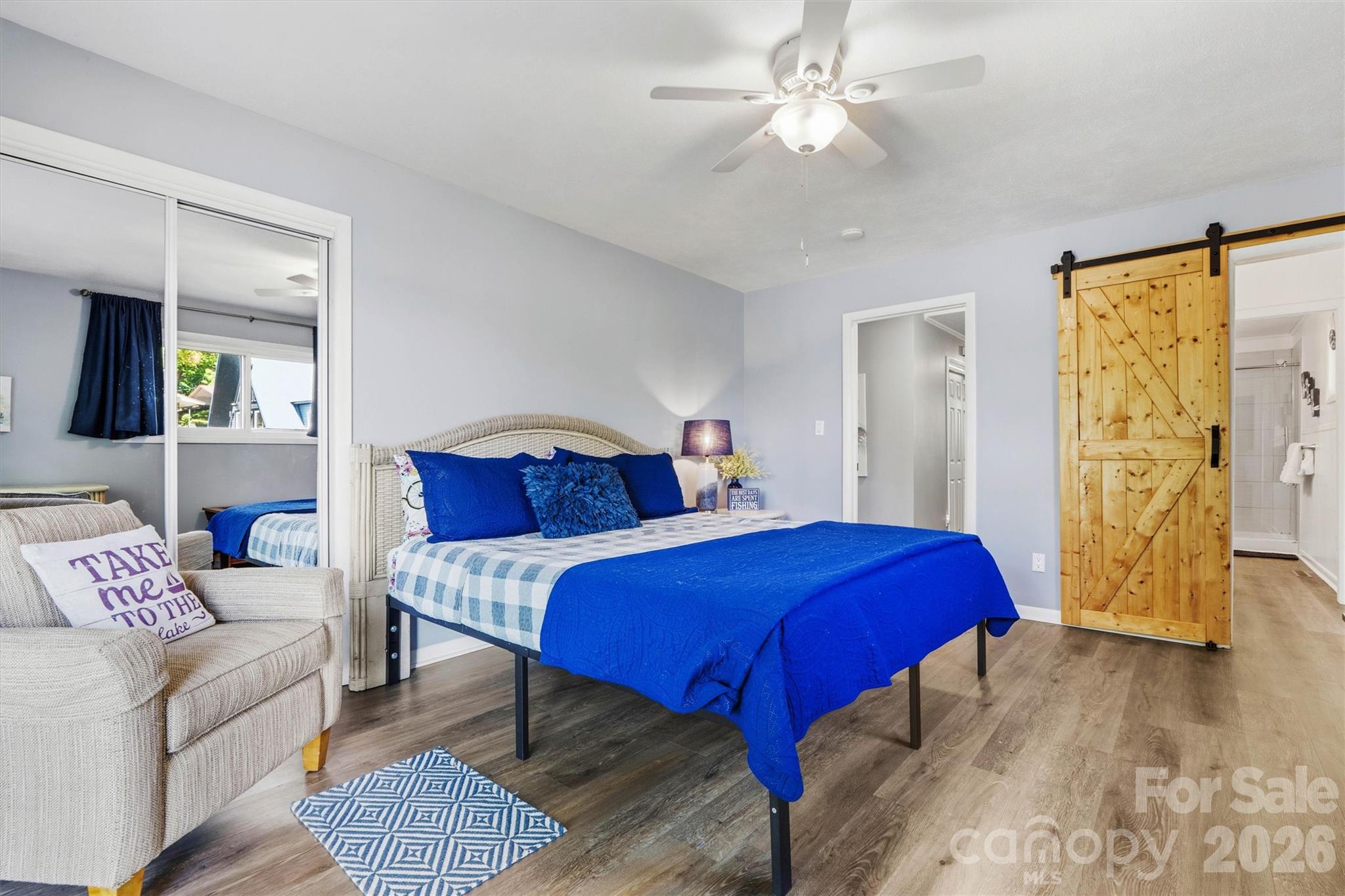 6566 Harbor Lane Conover, NC 28613 - Photo 17 of 43 a bedroom with a bed and wooden floor