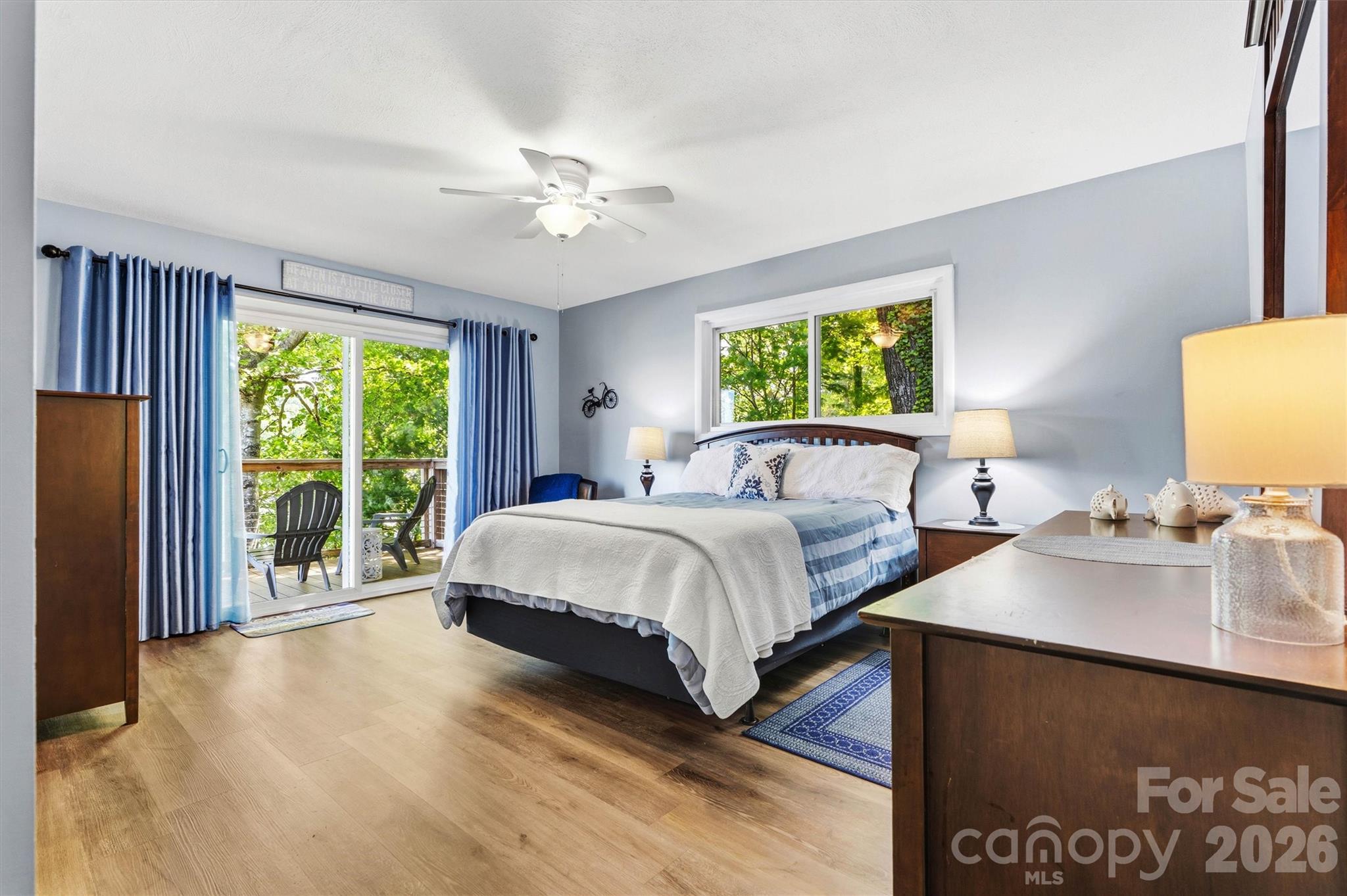 6566 Harbor Lane Conover, NC 28613 - Photo 20 of 43 a spacious bedroom with a bed and a chandelier