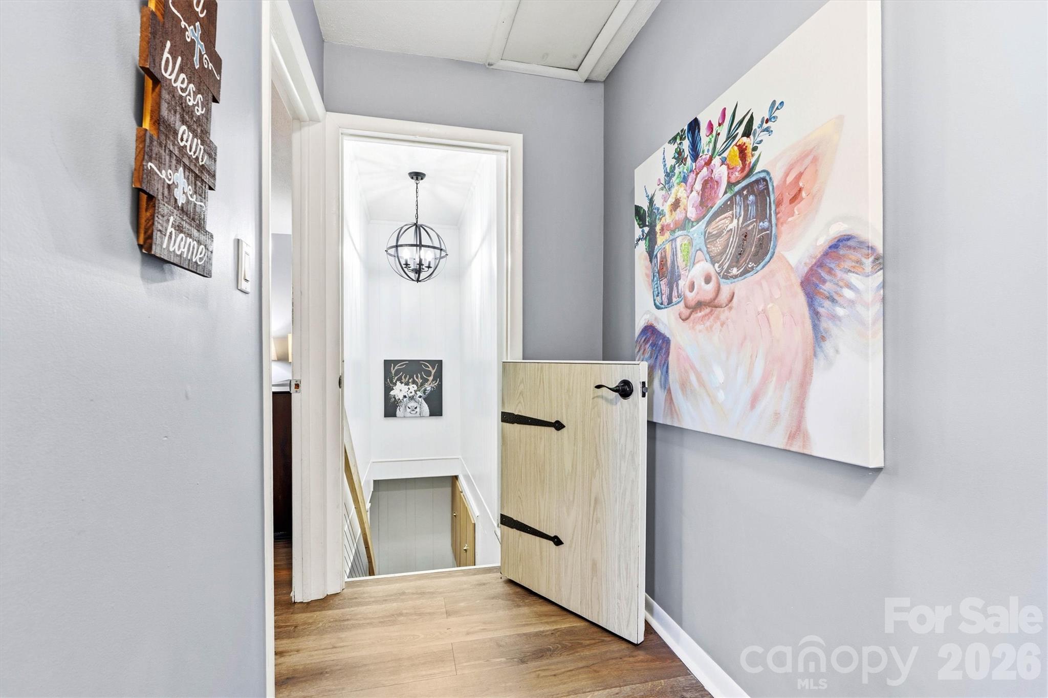 6566 Harbor Lane Conover, NC 28613 - Photo 26 of 43 a view of a hallway with paintings on the wall