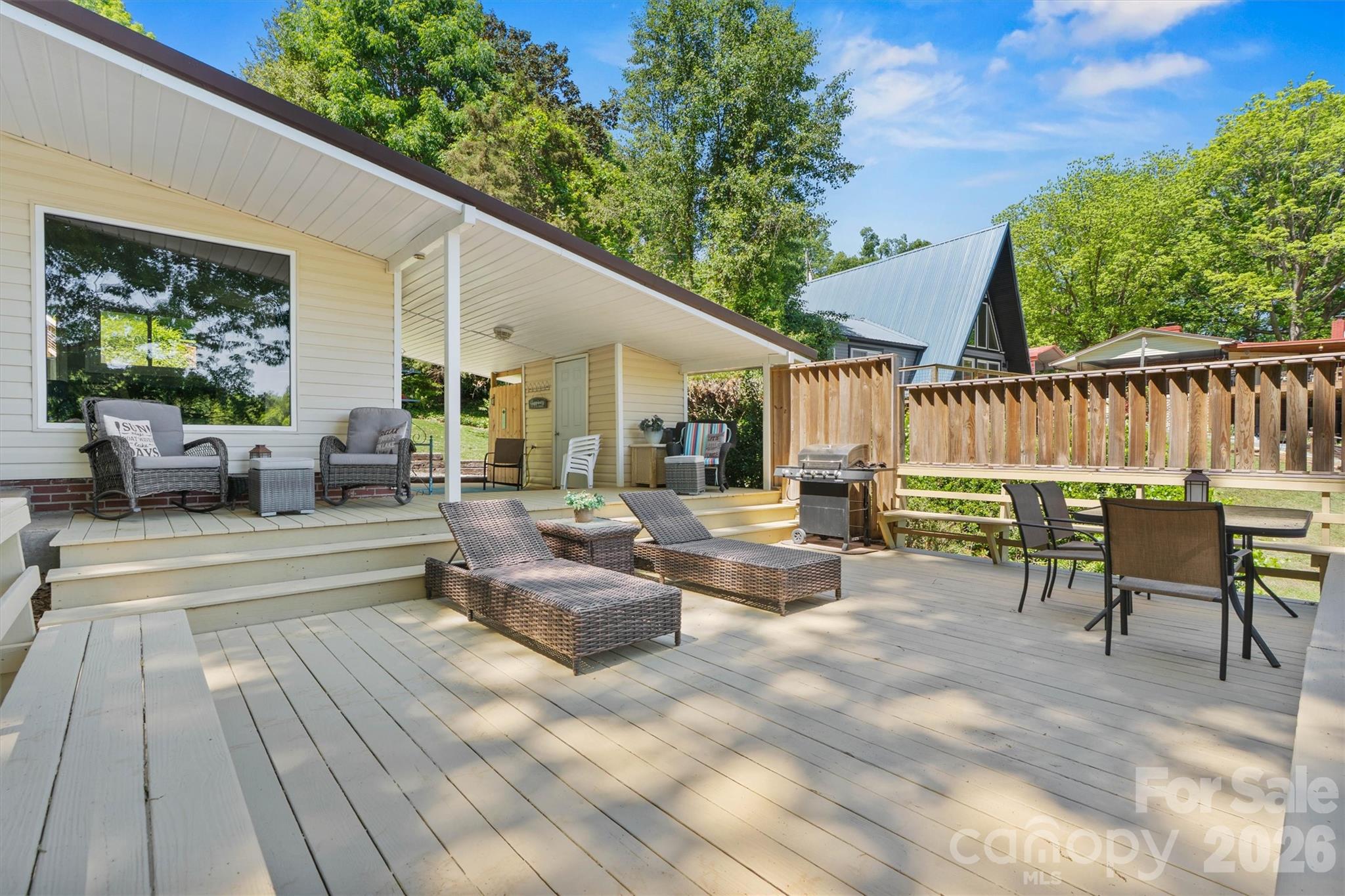 6566 Harbor Lane Conover, NC 28613 - Photo 36 of 43 a view of a patio with couches chairs and wooden floor