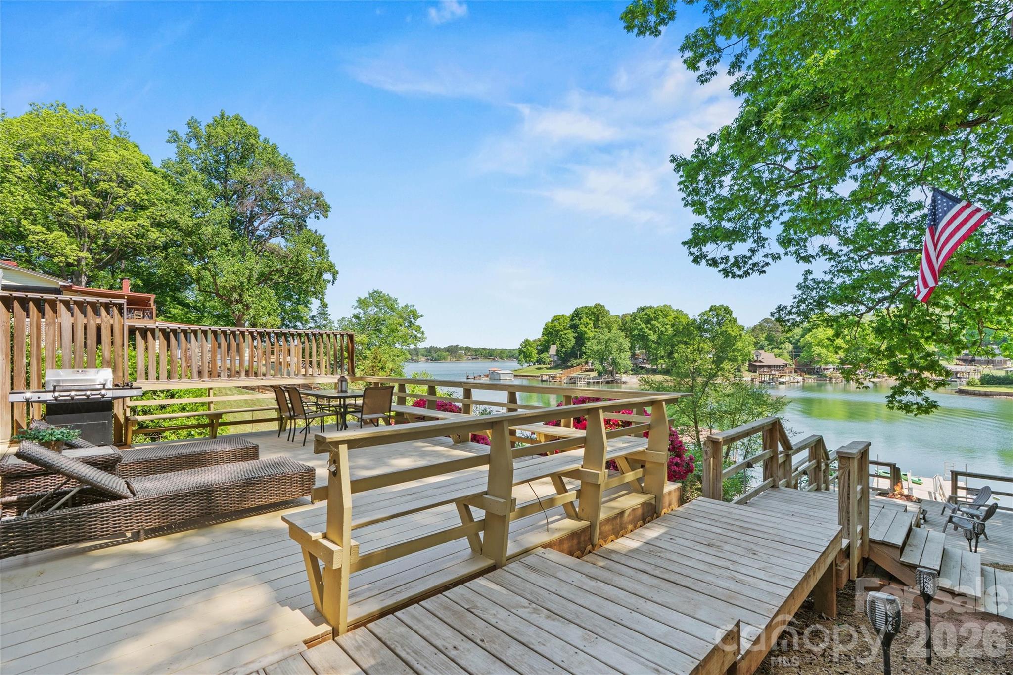 6566 Harbor Lane Conover, NC 28613 - Photo 37 of 43 a view of a deck with chairs a barbeque with wooden floor and fence