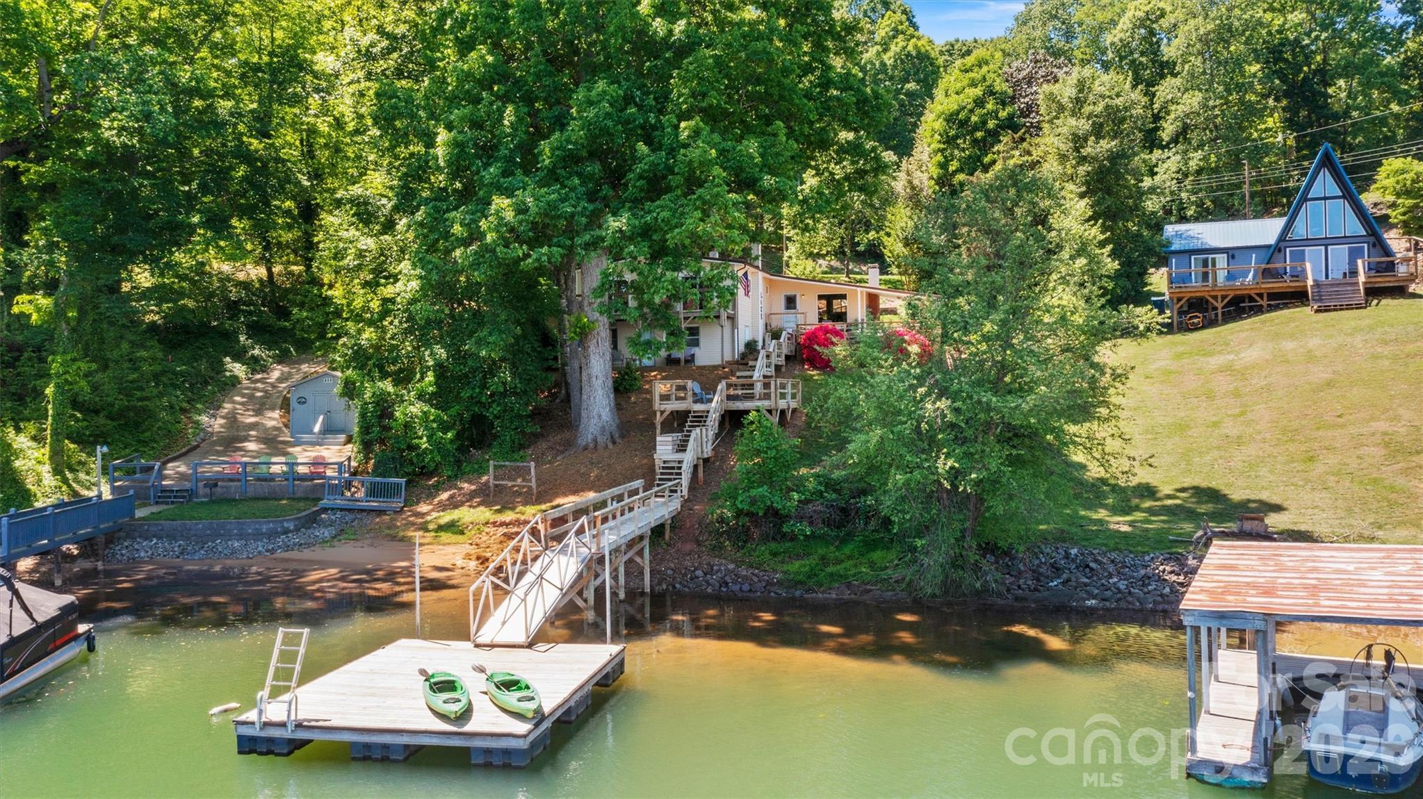 6566 Harbor Lane Conover, NC 28613 - Photo 4 of 43 a view of a swimming pool with lawn chairs and a yard