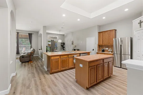 a kitchen with wooden cabinets and sink