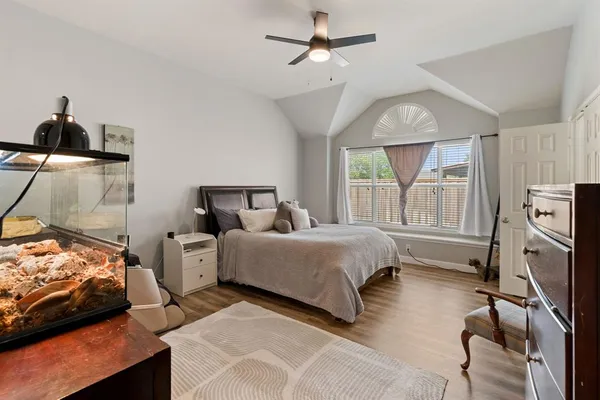 a bedroom with a bed and a dresser