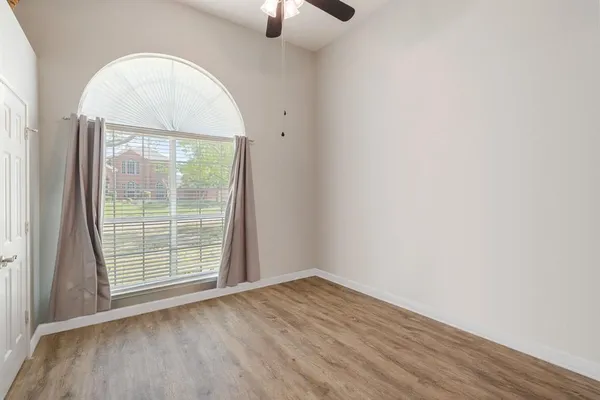 a view of a livingroom with furniture and a flat screen tv