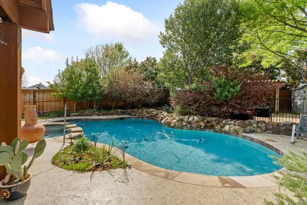 a view of a house with backyard porch and sitting area