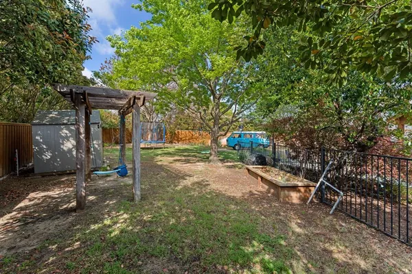 an aerial view of a house with outdoor space